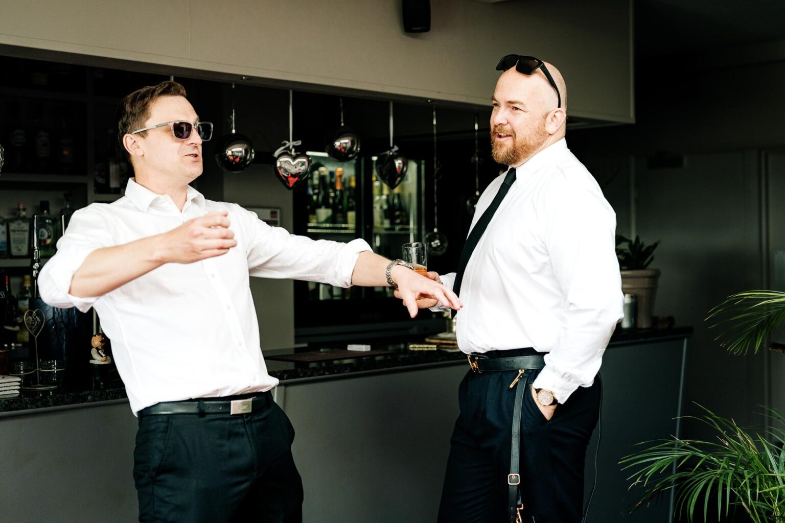 Groom and best man share a morning drink before the River Cottage wedding