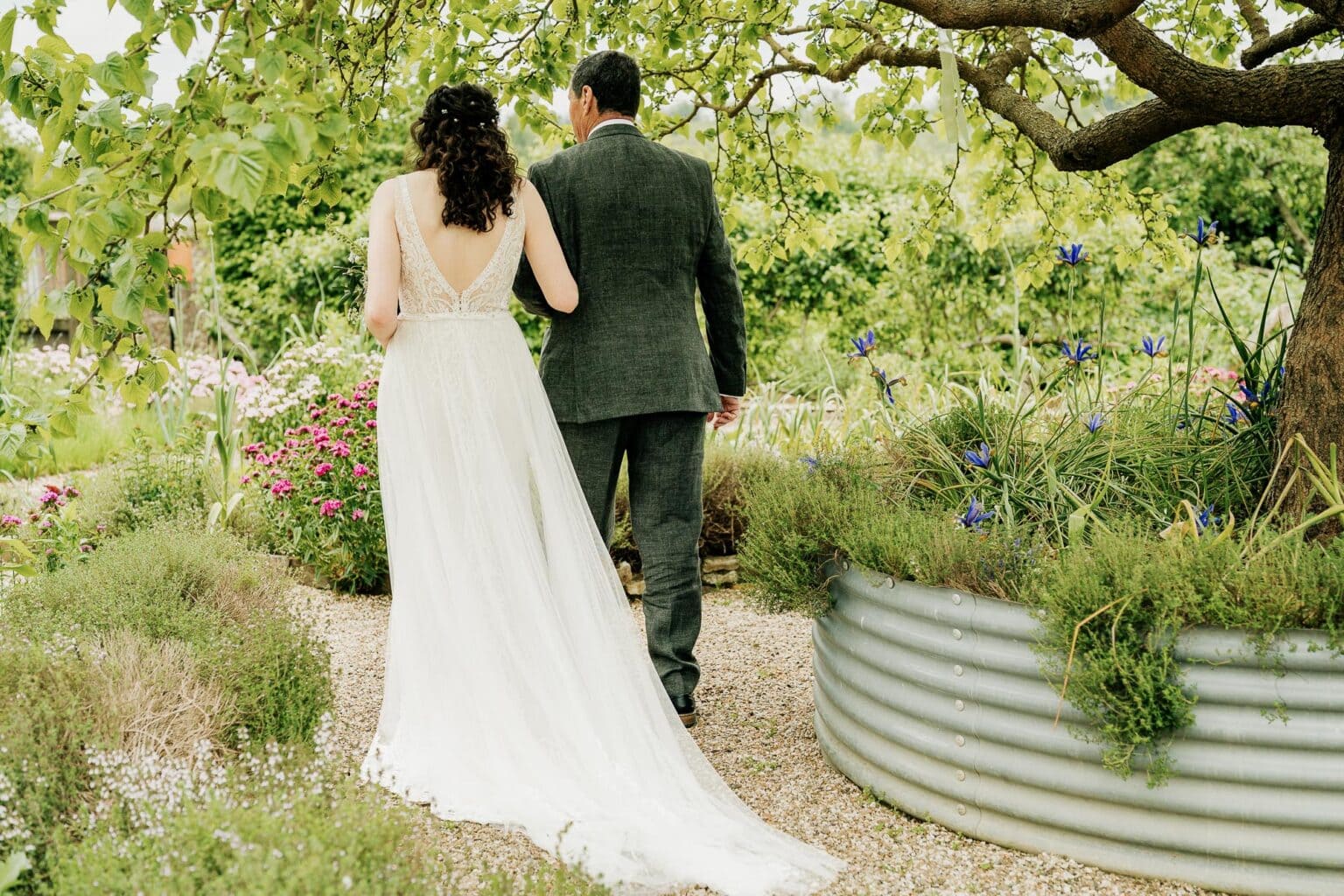 Bride and her father from behind at River Cottage wedding