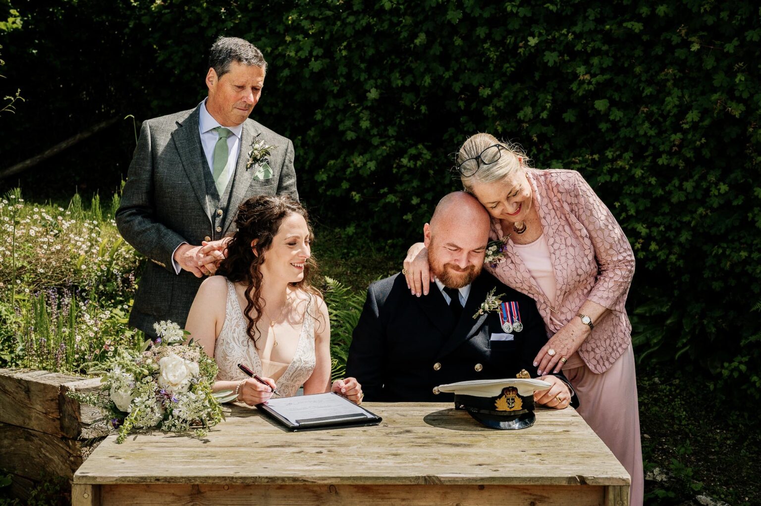 loving cuddle from the grooms mum at River Cottage garden wedding