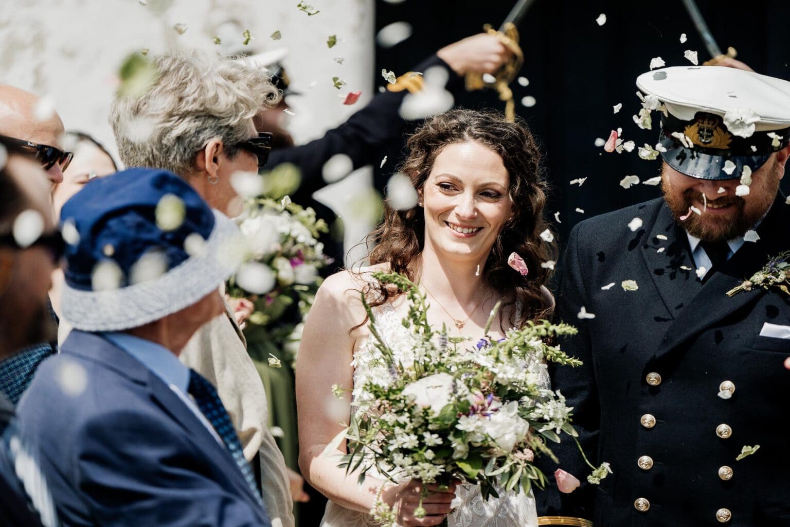 bride gets a faceful of confetti at River Cottage garden wedding