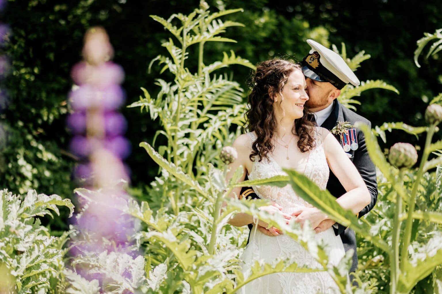 bride and groom having a quiet moment in the kitchen garden at River Cottage HQ garden wedding