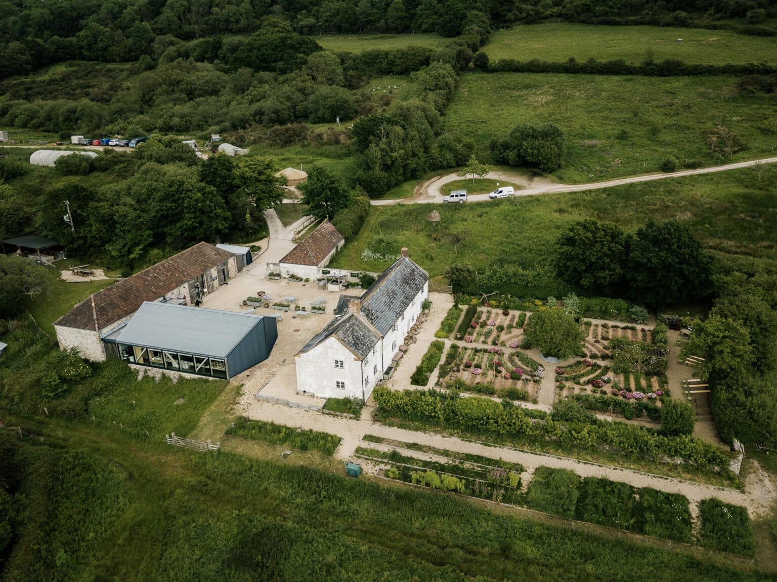 River Cottage HQ wedding - The grounds including the barn photographed from the air