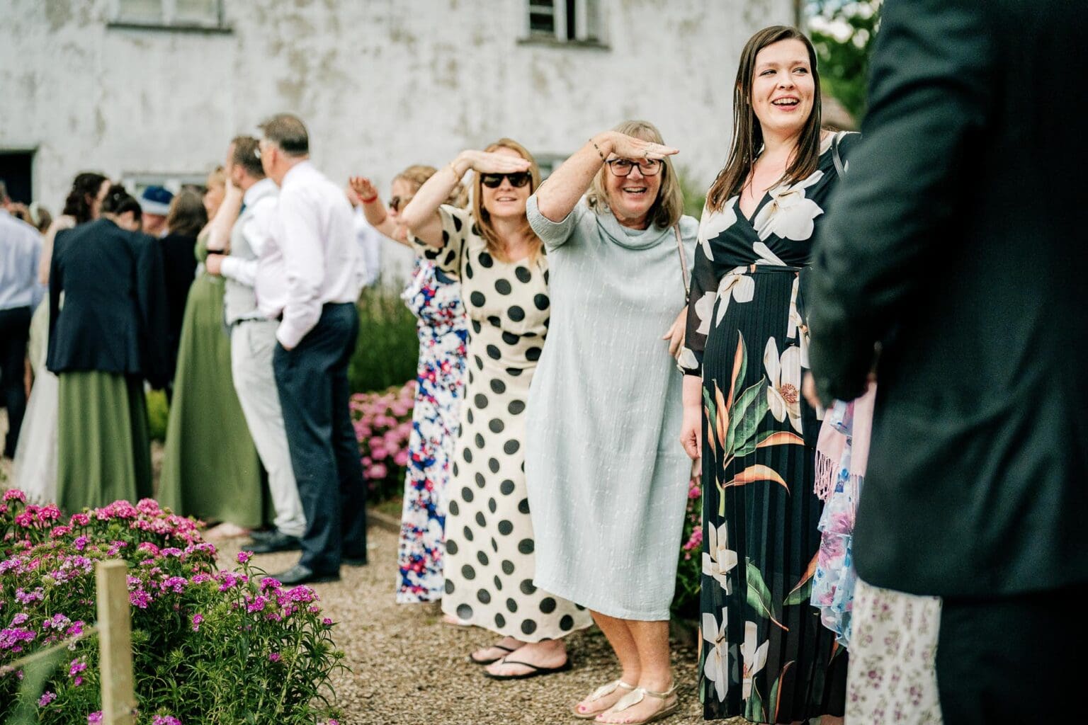 Guests dancing the sea shanty in the garden at River cottage HQ wedding