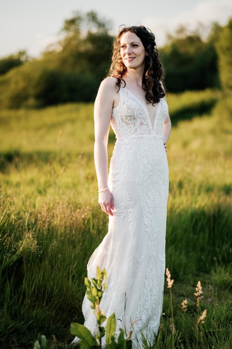 Bride posing in the meadow at River cottage HQ wedding