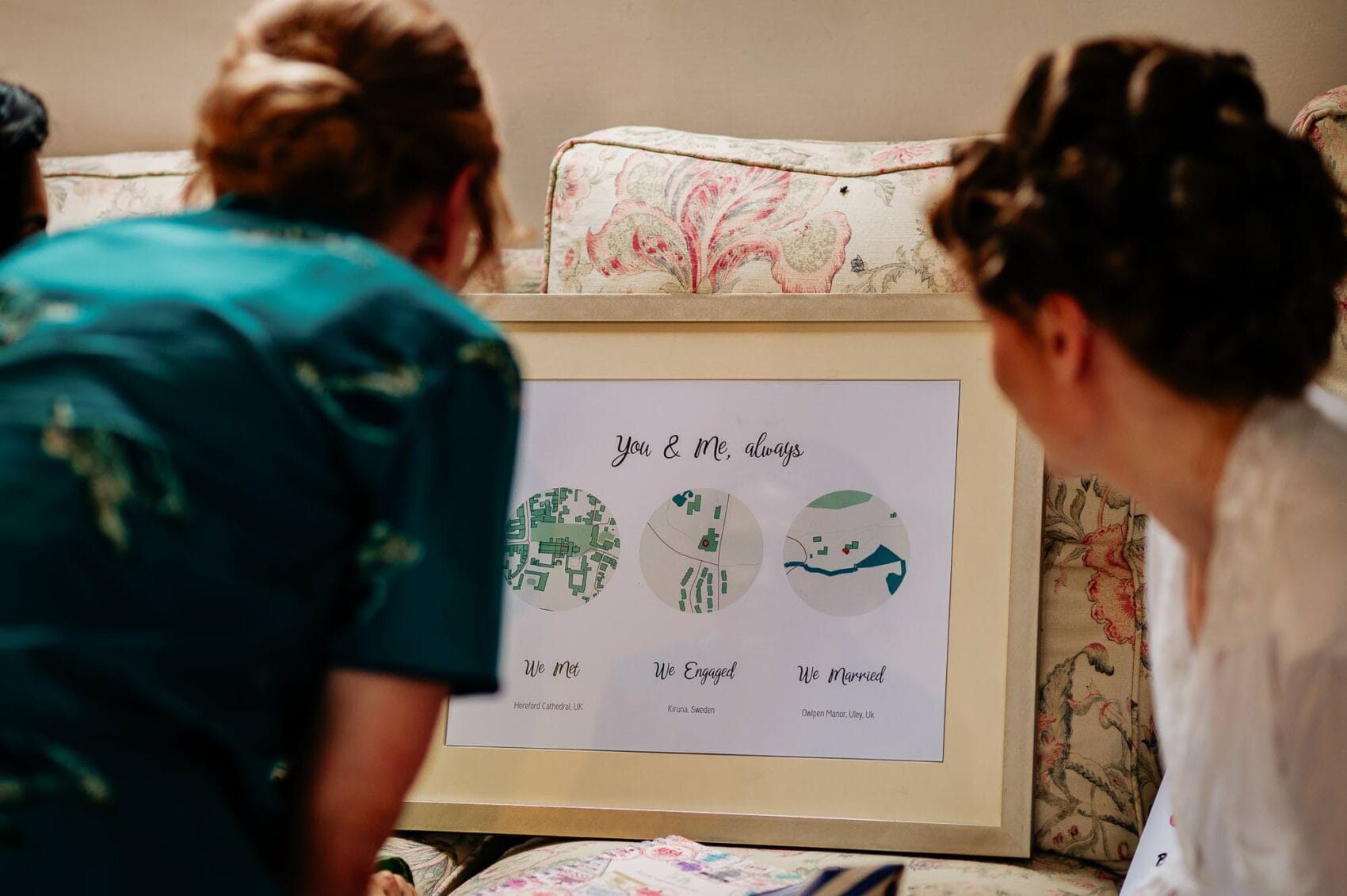 Bride admiring her gift from the groom at Owlpen Manor weddding