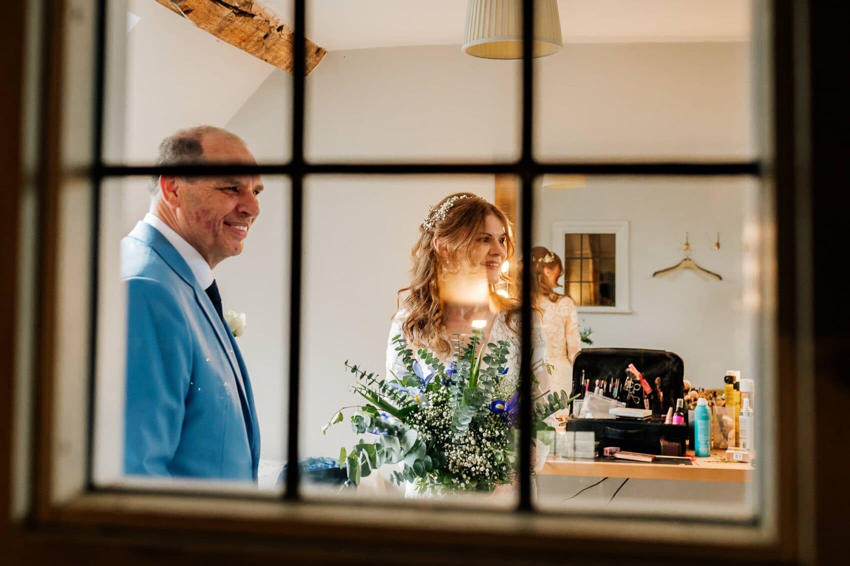 Dad and Daughter spend a quiet moment together before the Owlpen Manor weddding ceremony