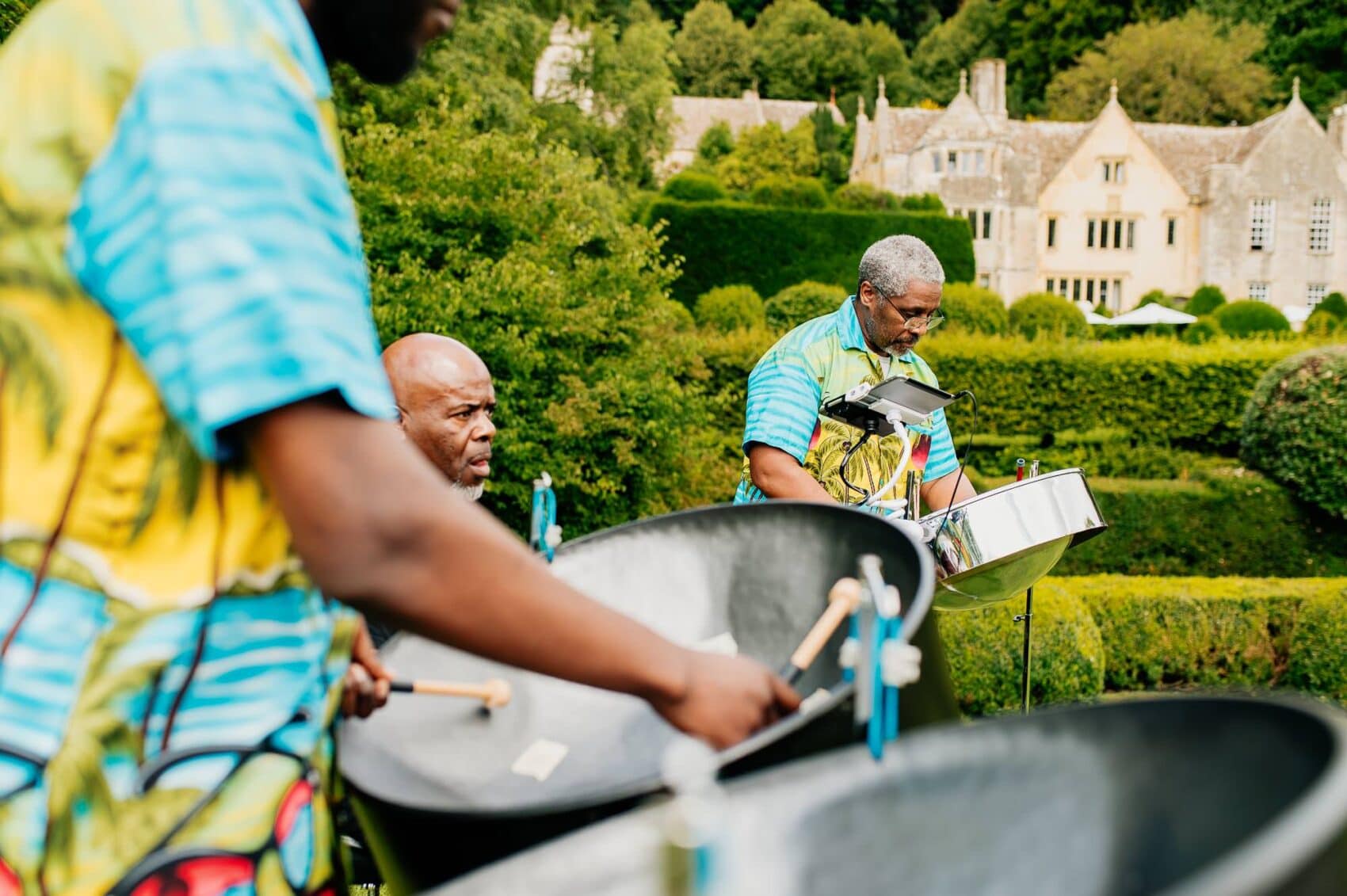 Steel pan band play for the ceremony at Owlpen Manor weddding