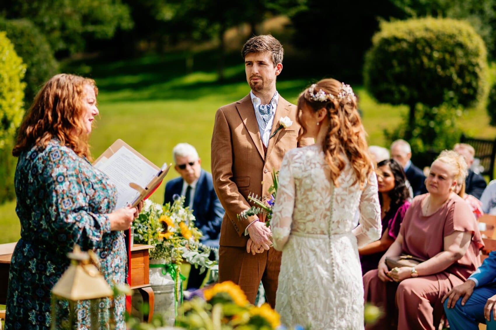 Celebrant saying the handfasting at Owlpen Manor weddding