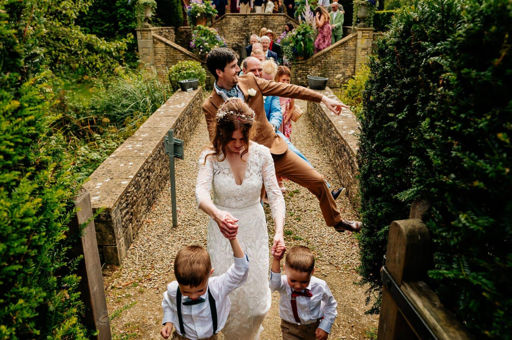 Walking through the gardens at Owlpen Manor weddding