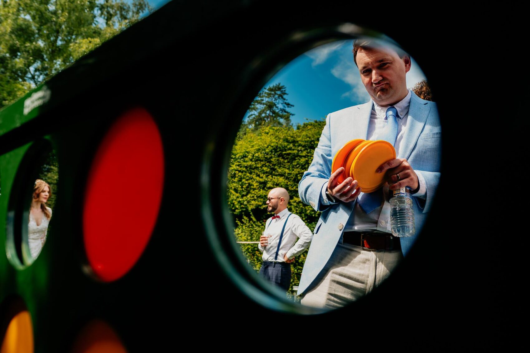 Guest plays Connect four at Owlpen Manor weddding