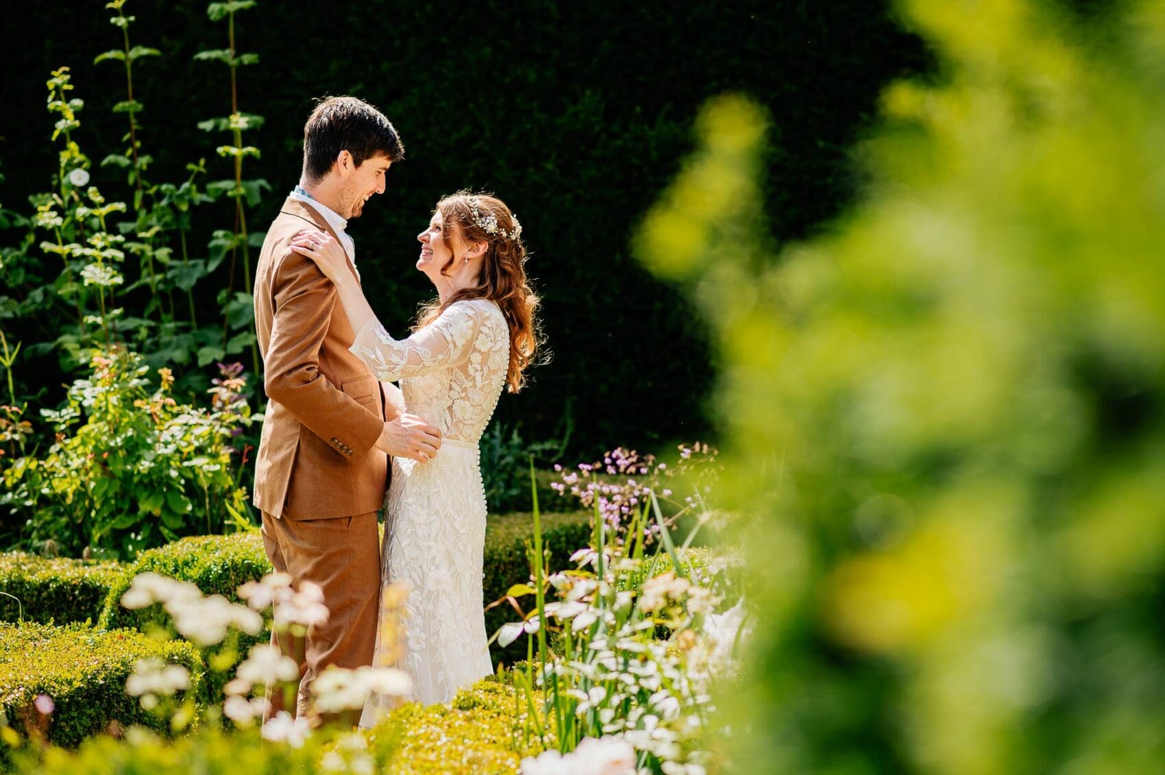 Summer foliage freom athe bride and groom at Owlpen Manor weddding