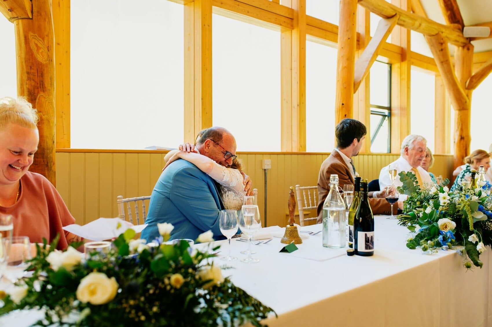 Bride cuddles her dad after his speech