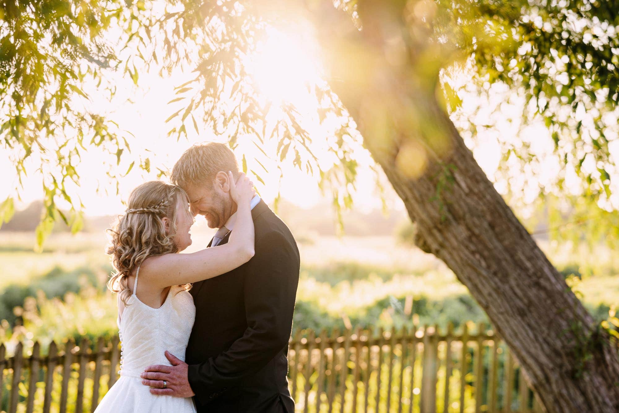 Bride and Groom against the sunset at Sopley Mill 