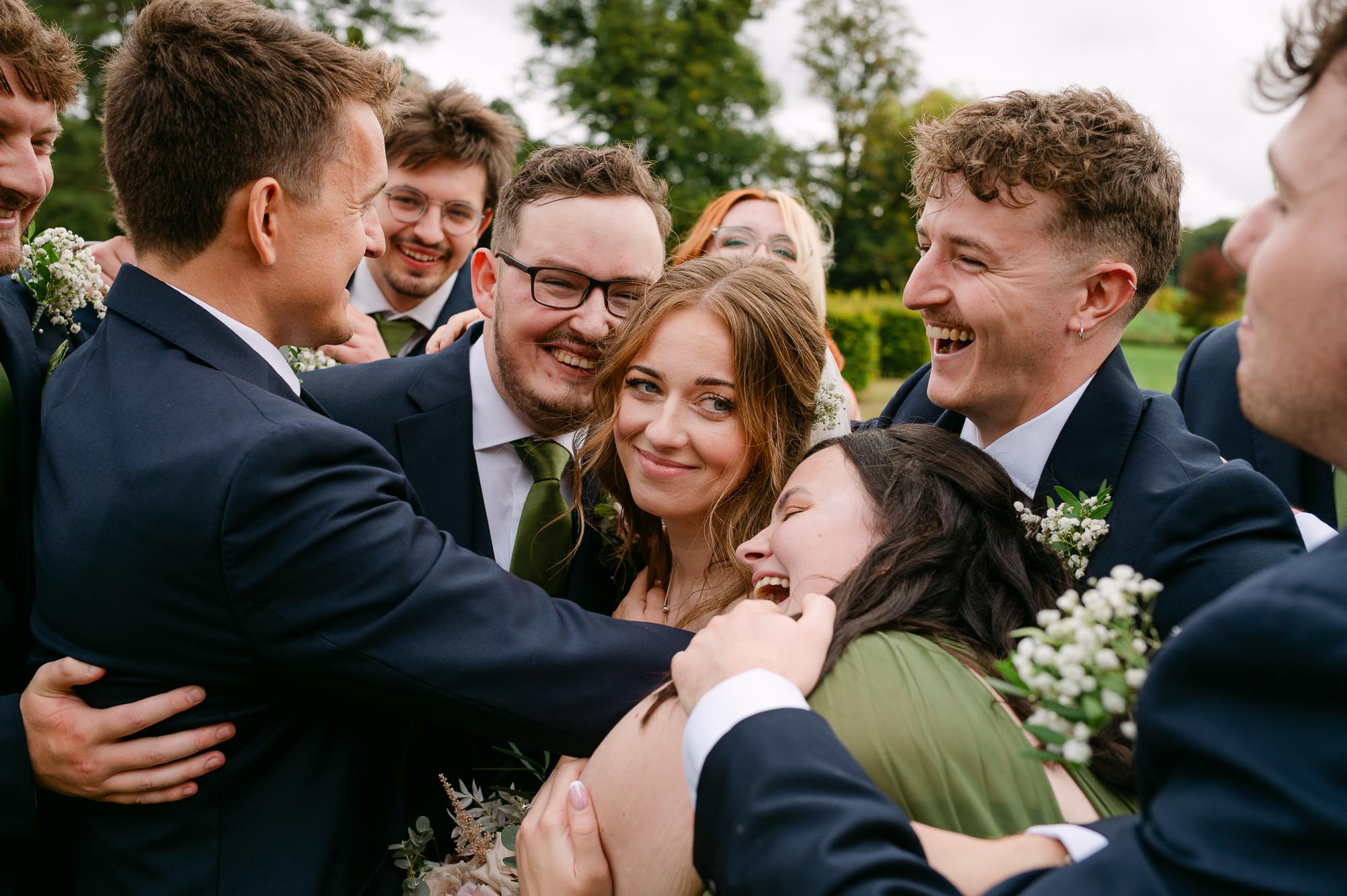 The whole Bridal Party hug before St Giles House