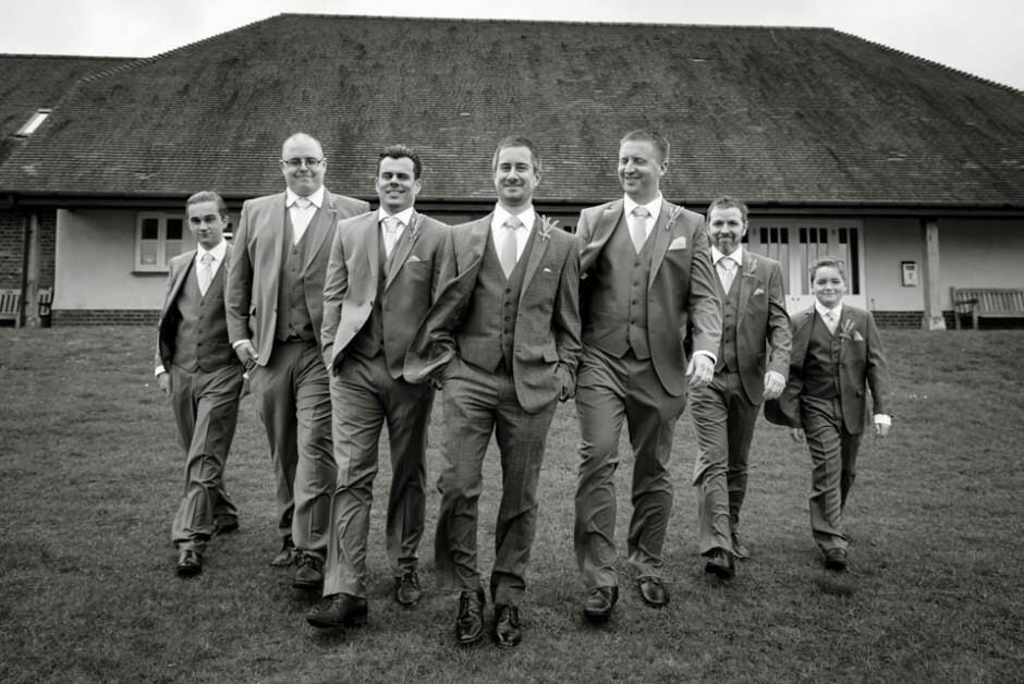 Groom and Groomsmen take a stroll in black and white