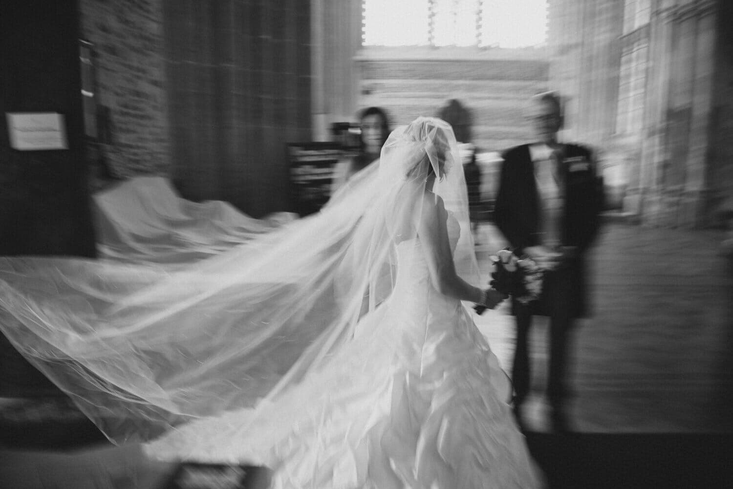 Bride in motion at Milton Abbey wedding