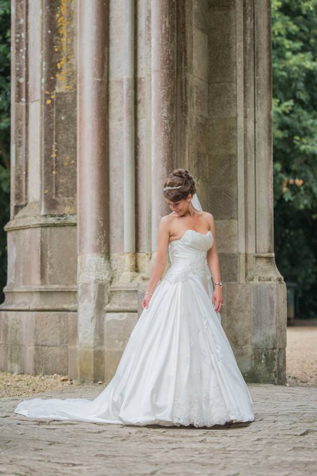bride poses at Highcliffe castle
